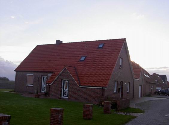 Haus Warfsmann Eingang zur Ferienwohnung mit zugehöriger Rasenfläche
